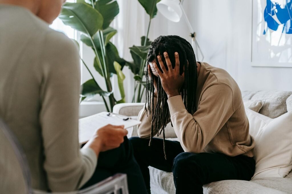 a person taking trauma-informed therapy from a therapist